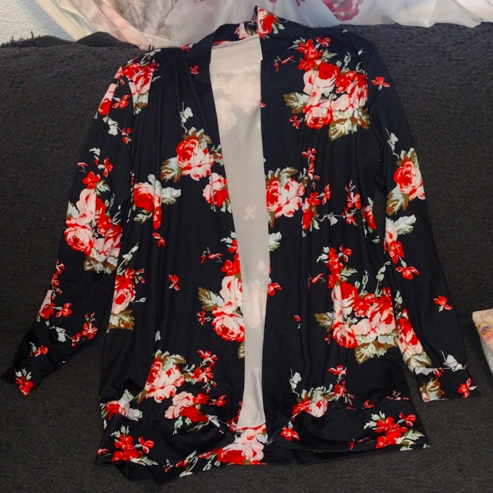 Black floral long sleeve open faced jacket. Size large.